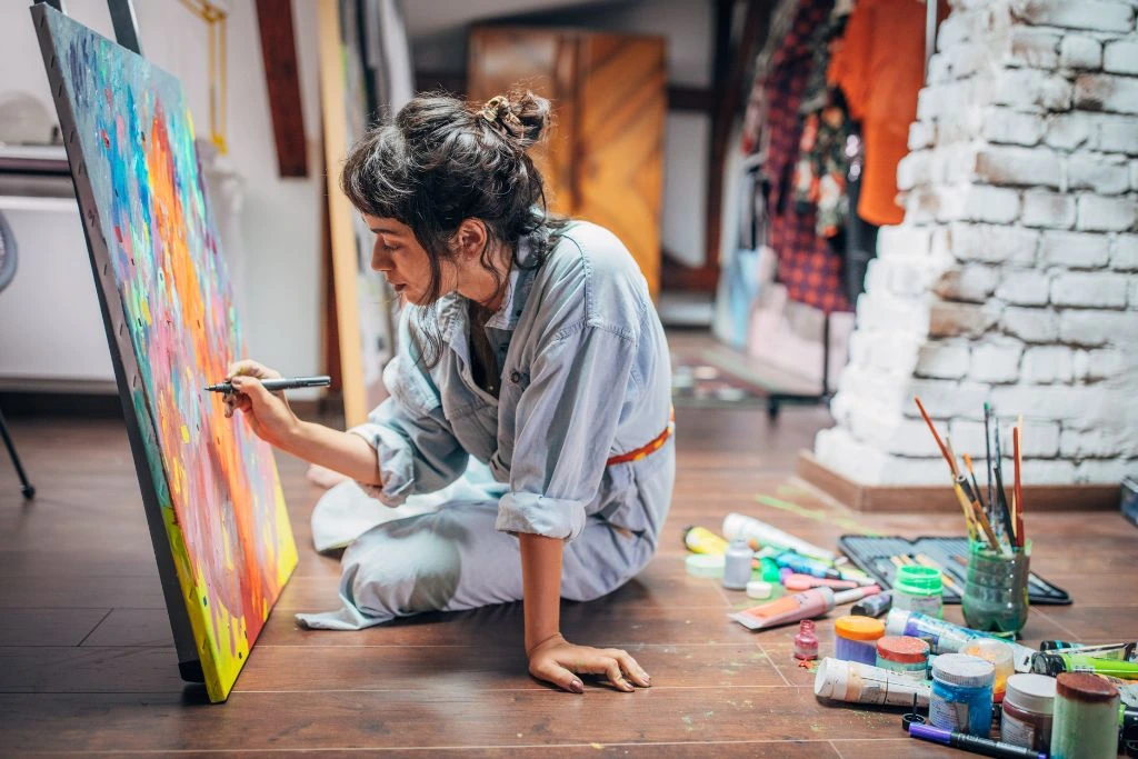 An artist painting on a canvas