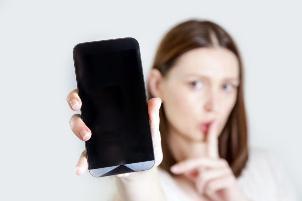 A woman holding her phone