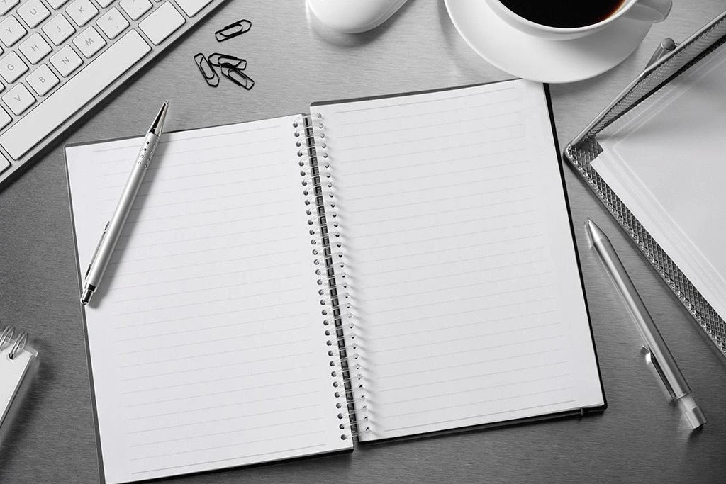 An open notebook on a desk