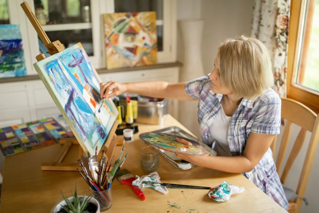 woman painting on a canvas