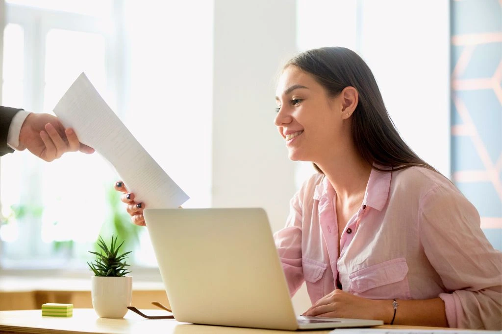 Female employee getting positive feedback from employer