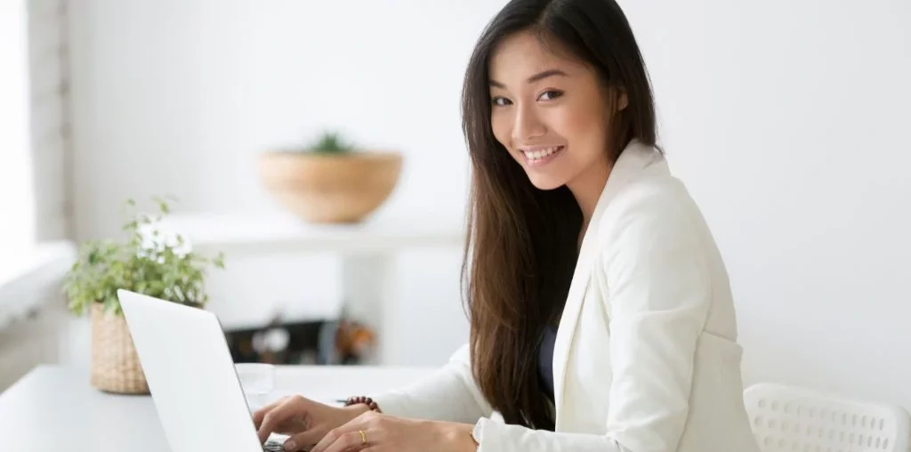 young female employee in front of her laptop