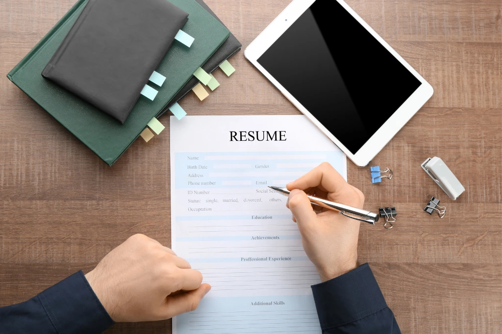 a person filling up their resume