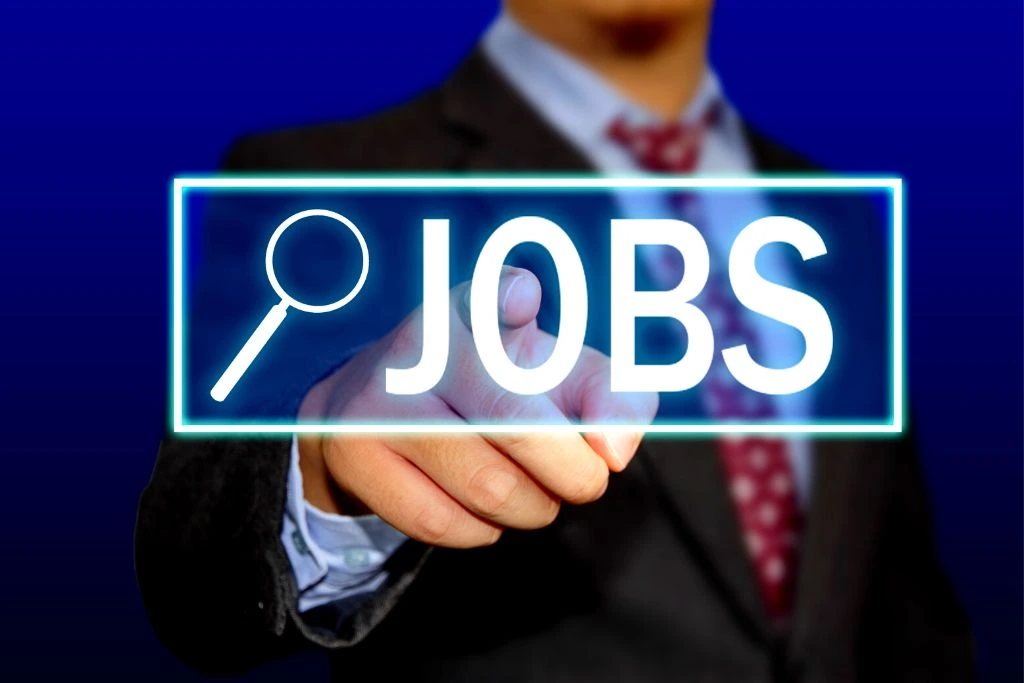 there is a jobs text in the center of the image with a background of a man clicking it